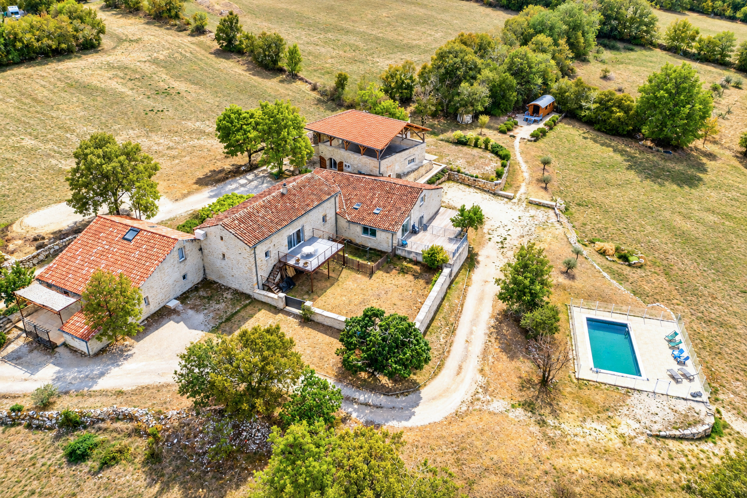 Residential land with 2 outbuildings, 2 swimming pools and a shepherd's hut